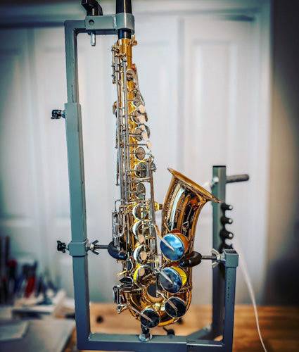 Saxophone Overhaul in saxophone repair holder