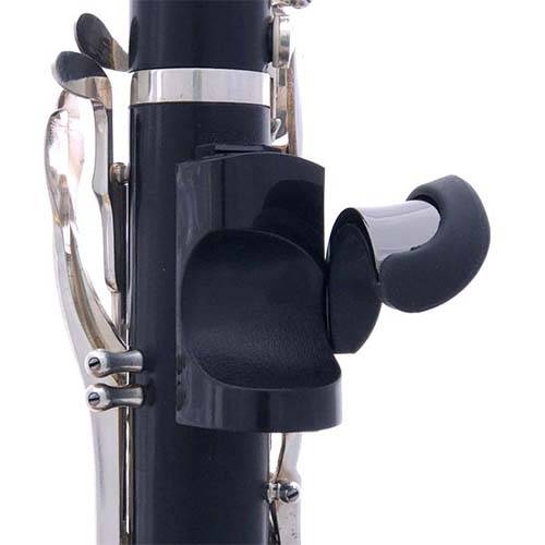 Close-up of a clarinet fitted with the Ton Kooiman Etude Thumb Rest, highlighting the adjustable position on the instrument